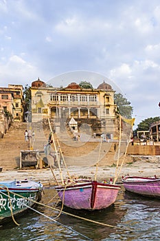 people cross the ganges by ferry