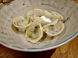 Vareniki with Sour Cream in Bowl.