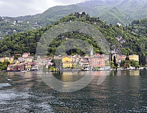 Varenna with the spire of the Church of Saint George from a ferry on Lake Como. photo