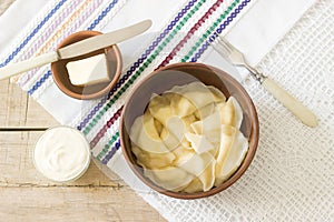 Varenyky, vareniki, pierogi, pyrohy or dumplings served with sour cream and butter.