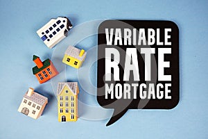 Variable Rate Mortgage text with house models on blue background