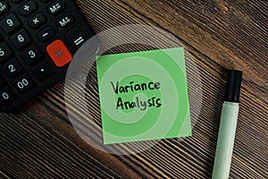 Variance Analysis write on sticky notes isolated on Wooden Table photo