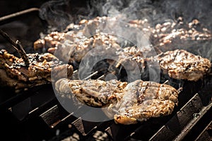 Varias Grilled chicken breast on barbeque photo