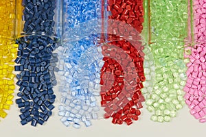 Colored plastic resins in test tubes in laboratory photo
