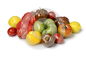 Variation of fresh whole juicy tomatoes isolated on white background photo