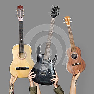 Variation of hands holding guitars