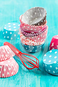Variation of small paper forms for baking cupcakes and muffins with wisp photo