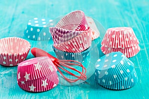 Variation of small paper forms for baking cupcakes and muffins with wisp photo