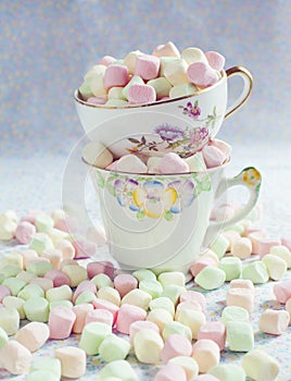 Varicolored marshmallows in antique cups.