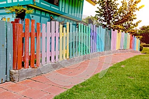 Varicolored wooden fence with walkway in garden,wood pattern