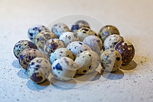 Variegated quail eggs with small brown specks