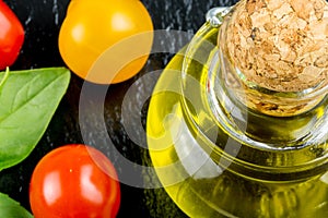 Varieties of colorful tomatos and olive oil