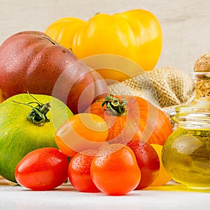 Varieties of colorful tomatos and olive oil