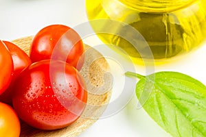 Varieties of colorful tomatos and olive oil