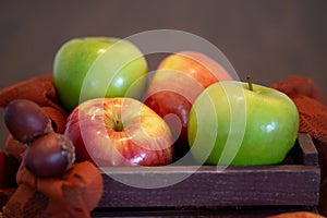 Variety of apples in a wooden basket
