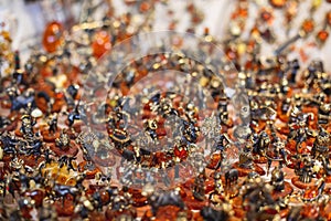 Variety assortment of souvenirs made of amber, traditional tourist souvenirs and gifts from Kaliningrad, Russia, in local vendor