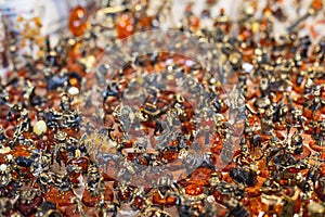 Variety assortment of souvenirs made of amber, traditional tourist souvenirs and gifts from Kaliningrad, Russia, in local vendor