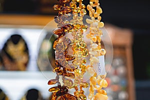 Variety assortment of souvenirs made of amber, traditional tourist souvenirs and gifts from Kaliningrad, Russia, in local vendor