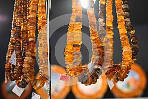 Variety assortment of souvenirs made of amber, traditional tourist souvenirs and gifts from Kaliningrad, Russia, in local vendor