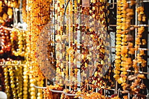 Variety assortment of souvenirs made of amber, traditional tourist souvenirs and gifts from Kaliningrad, Russia, in local vendor