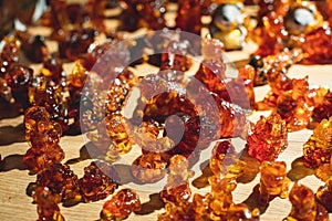 Variety assortment of souvenirs made of amber, traditional tourist souvenirs and gifts from Kaliningrad, Russia, in local vendor