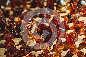 Variety assortment of souvenirs made of amber, traditional tourist souvenirs and gifts from Kaliningrad, Russia, in local vendor