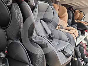 Variety of baby car seats on a shelf in a store