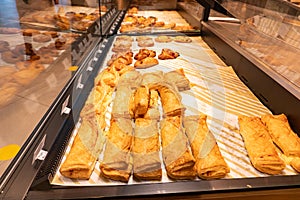 Variety of baked products at a supermarket. Display of a bakery there is a wide variety of baked goods to offer