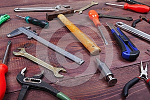 Variety of bench tools for repair work on wooden background