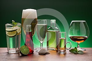 Variety of beverages on green background