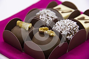 Variety of bonbons, chocolate and coconut, white chocalate and chocolate with chestnut.