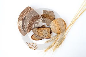 Variety of bread and stalks of wheat