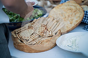 A variety of breads are displayed for a wedding reception