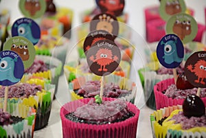 Variety of brightly decorated cupcakes