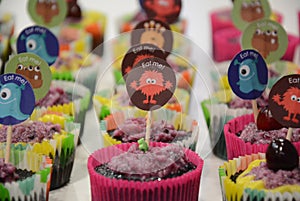 Variety of brightly decorated cupcakes photo
