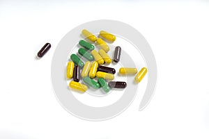 Variety of capsules on white background