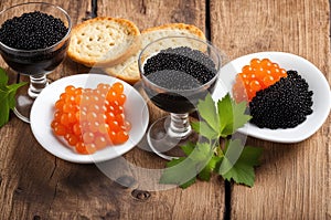 Variety of Caviar in Glassware and White Plates with Crispbreads
