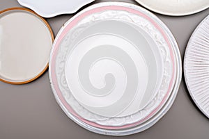 Variety of ceramic or porcelain trendy plates flat lay copy space