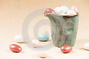 Variety of chocolate eggs in milk jar
