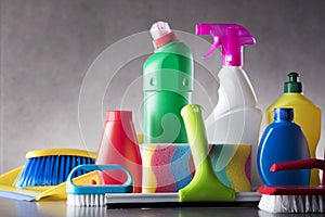 Variety cleaning products on gray background.