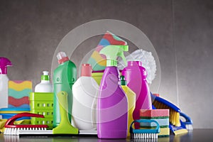 Variety cleaning products on gray background.