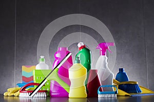 Variety cleaning products on gray background.