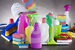 Variety cleaning products on gray background.