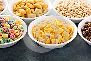 Variety of cold cereals in white bowls