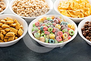 Variety of cold cereals in white bowls