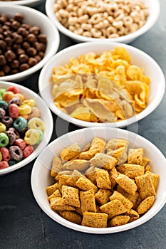 Variety of cold cereals in white bowls