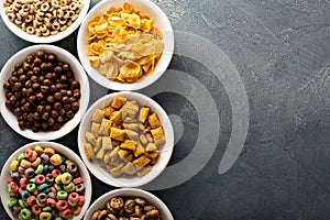 Variety of cold cereals in white bowls