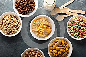 Variety of cold cereals in white bowls