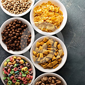 Variety of cold cereals in white bowls