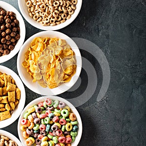 Variety of cold cereals in white bowls